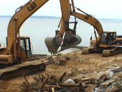 25 Two Cat Backhoe's Working Together_1
